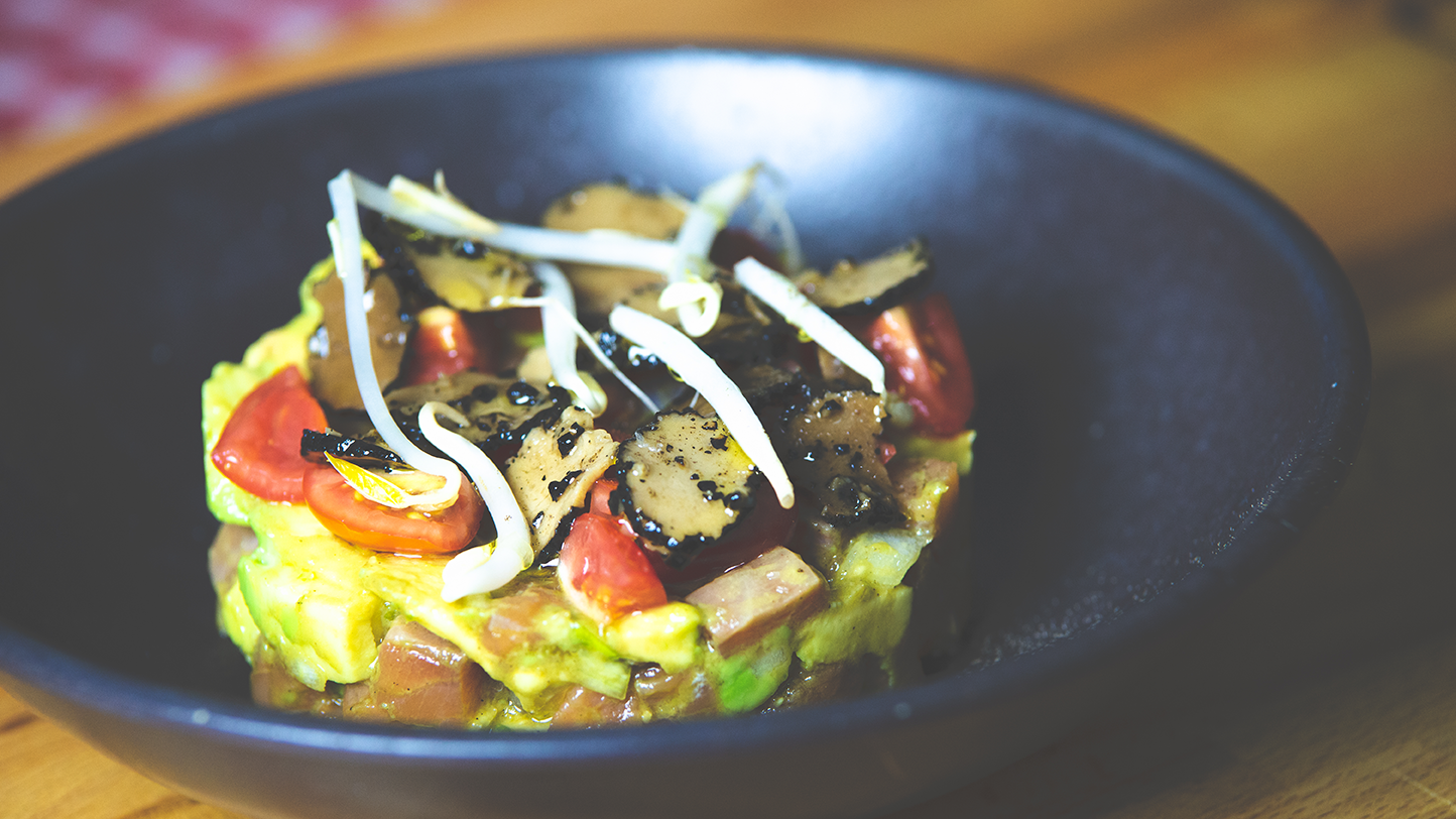 Salmon tartare with avocado, cherry tomatoes & summer truffle carpaccio